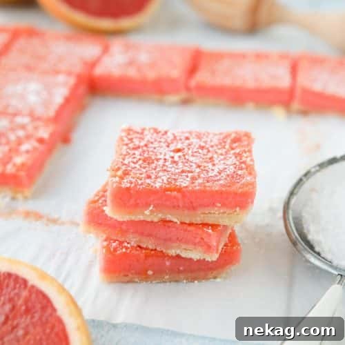 Grapefruit Bars are just like your favorite lemon bars with a shortbread crust and citrus curd, but with the sweeter flavor of pink or ruby red grapefruit.