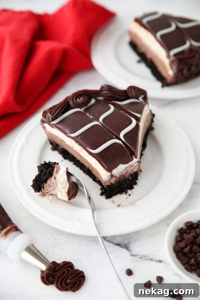 Decadent Black Tie Chocolate Mousse Cake Recipe 4 Piece of homemade Olive Garden Black Tie Mousse Cake on a plate with a forkful taken out.