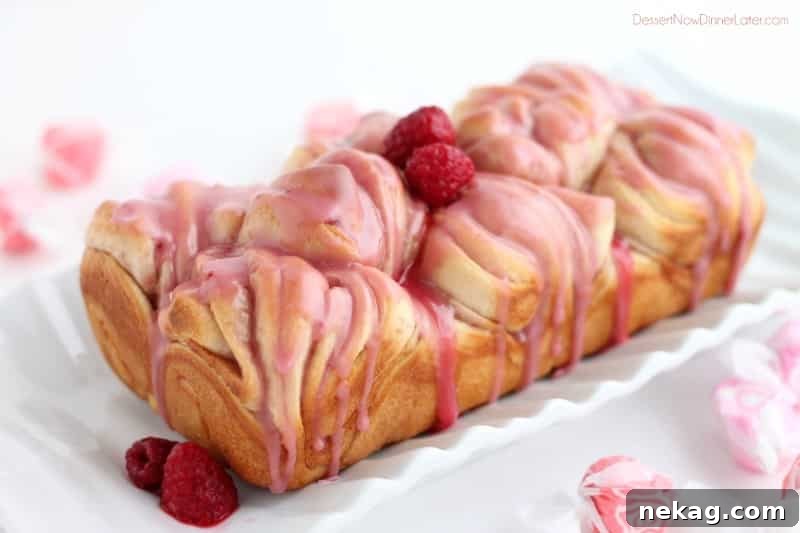 Raspberry butterflake loaf covered in glaze.