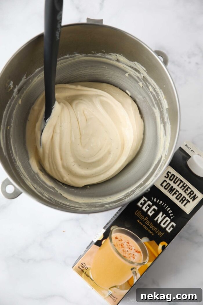 Whipped eggnog pastry cream in a mixing bowl.
