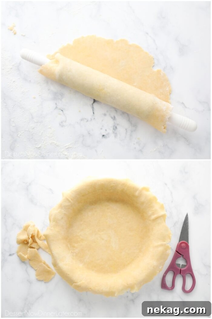 Transferring the easy pie crust to a pie dish.