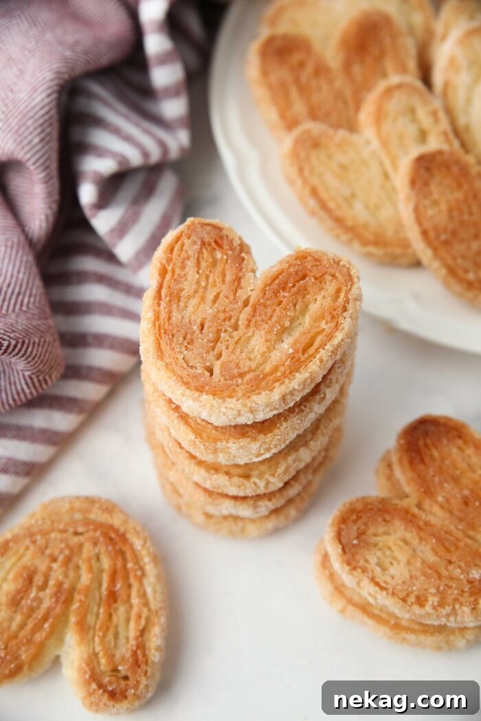 Two-Ingredient Palmiers: Crispy Puff Pastry Cookies 3 Stack of palmier cookies with a golden sugary crust.