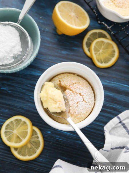Spoonful of lemon pudding cake in ramekin.