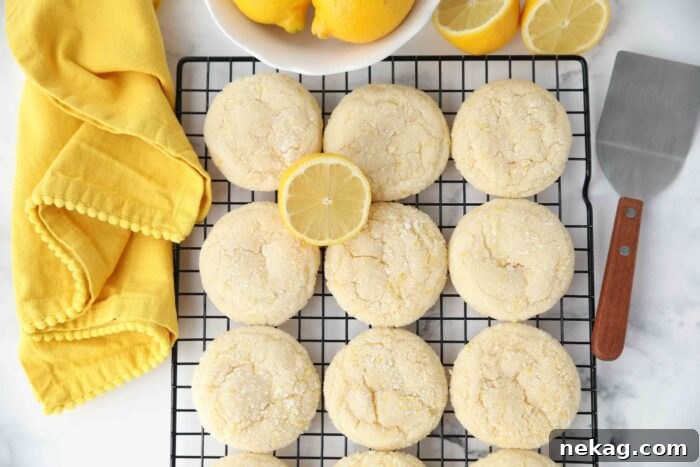 Lemon zest sugar cookies on a wire cooling rack.
