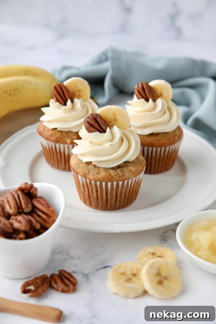 Southern-Style Hummingbird Cupcakes with Cream Cheese Frosting 10 Banana pineapple pecan cupcakes on a plate with cream cheese frosting.
