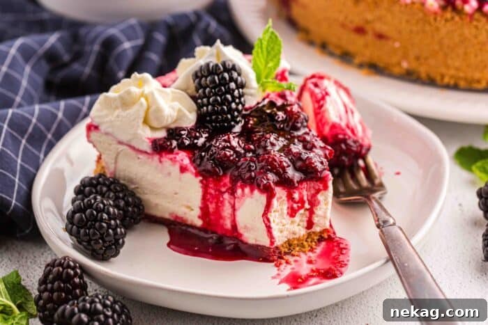 Forkful removed from a slice of no bake blackberry cheesecake.
