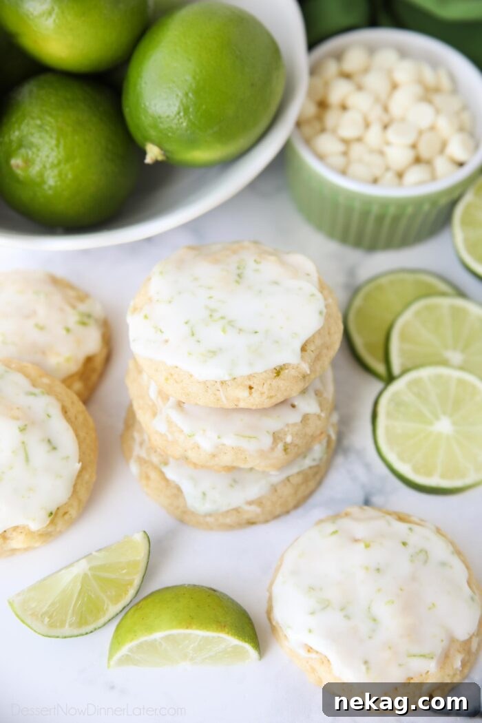 Stack of key lime cookies with white chocolate chips and a lime glaze.