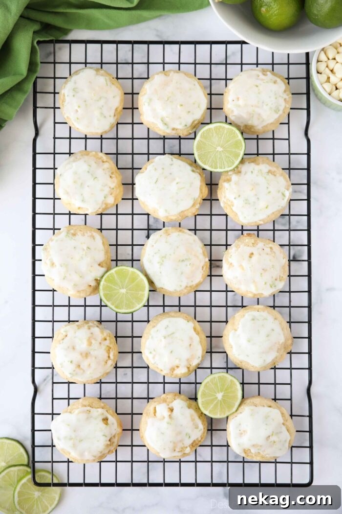 Top view of key lime cookies with glaze on wire cooling rack.