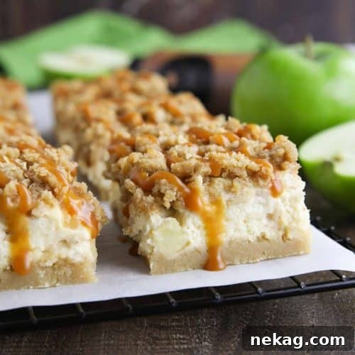 Close up of caramel apple cheesecake bars with caramel dripping down the side.