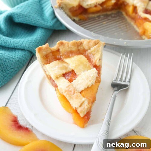 How to Make Classic Peach Pie (Step-by-Step Video) 12 Slice of peach pie made with frozen peaches on a plate.