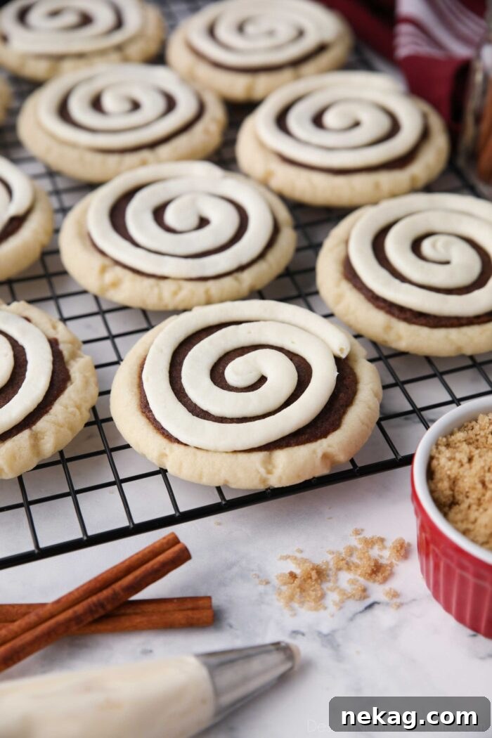 Copycat Crumbl Cinnamon Roll Cookies on a wire cooling rack.