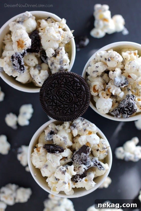 Cookies and Cream Popcorn - white chocolate and Oreos come together to flavor this air popped corn! From DessertNowDinnerLater.com