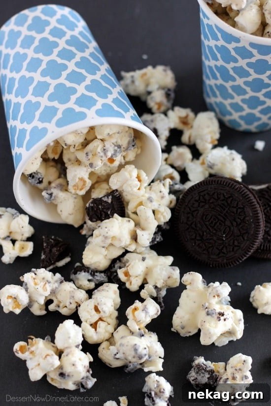 Cookies and Cream Popcorn - white chocolate and Oreos come together to flavor this air popped corn! From DessertNowDinnerLater.com