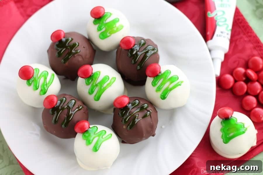 These traditionally made OREO Cookie Balls are decorated with green gel and a red candy coated chocolate piece for a festive Christmas Tree treat! From DessertNowDinnerLater.com