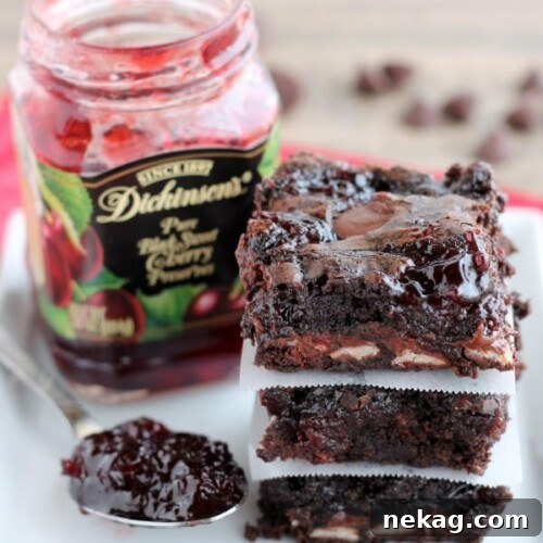 Decadent Dark Chocolate Cherry Brownies Recipe 6 Dark Chocolate Cherry Brownies are made from a doctored box mix that has cherry filled morsels and cherry preserves swirled throughout. From DessertNowDinnerLater.com