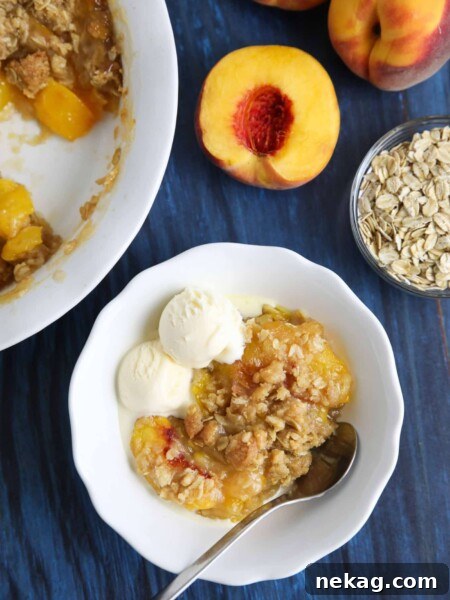 This easy peach crisp recipe (aka peach crumble) is loaded with fresh, juicy peaches topped with a generous helping of buttery brown sugar and oat streusel. Enjoy it with warm with a scoop of vanilla ice cream.