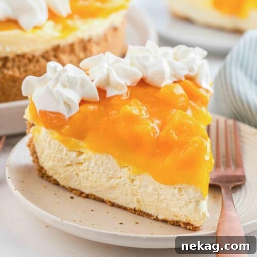 Slice of no bake peach cheesecake on a plate with a fork.