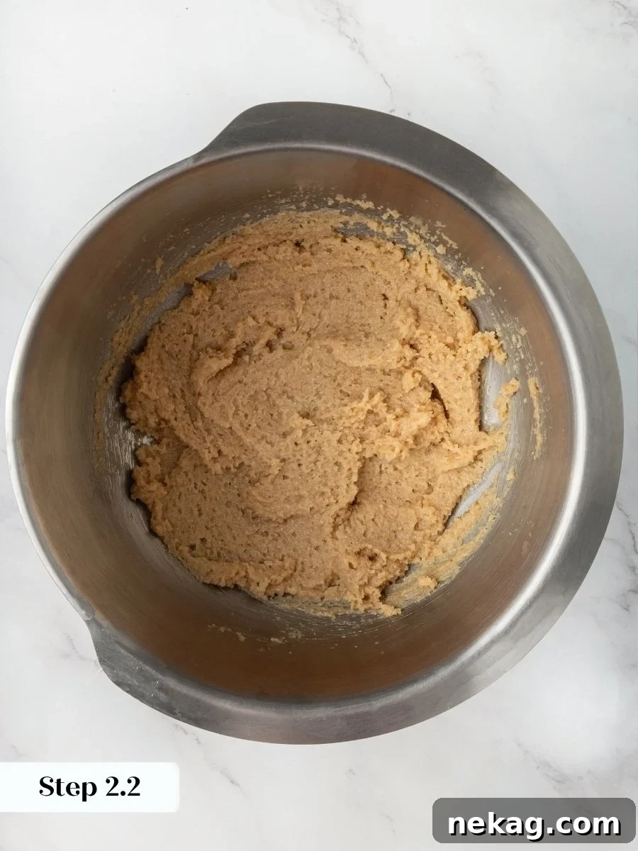 Creaming until light gives these almond flour chocolate chip cookies the structure to hold real height.