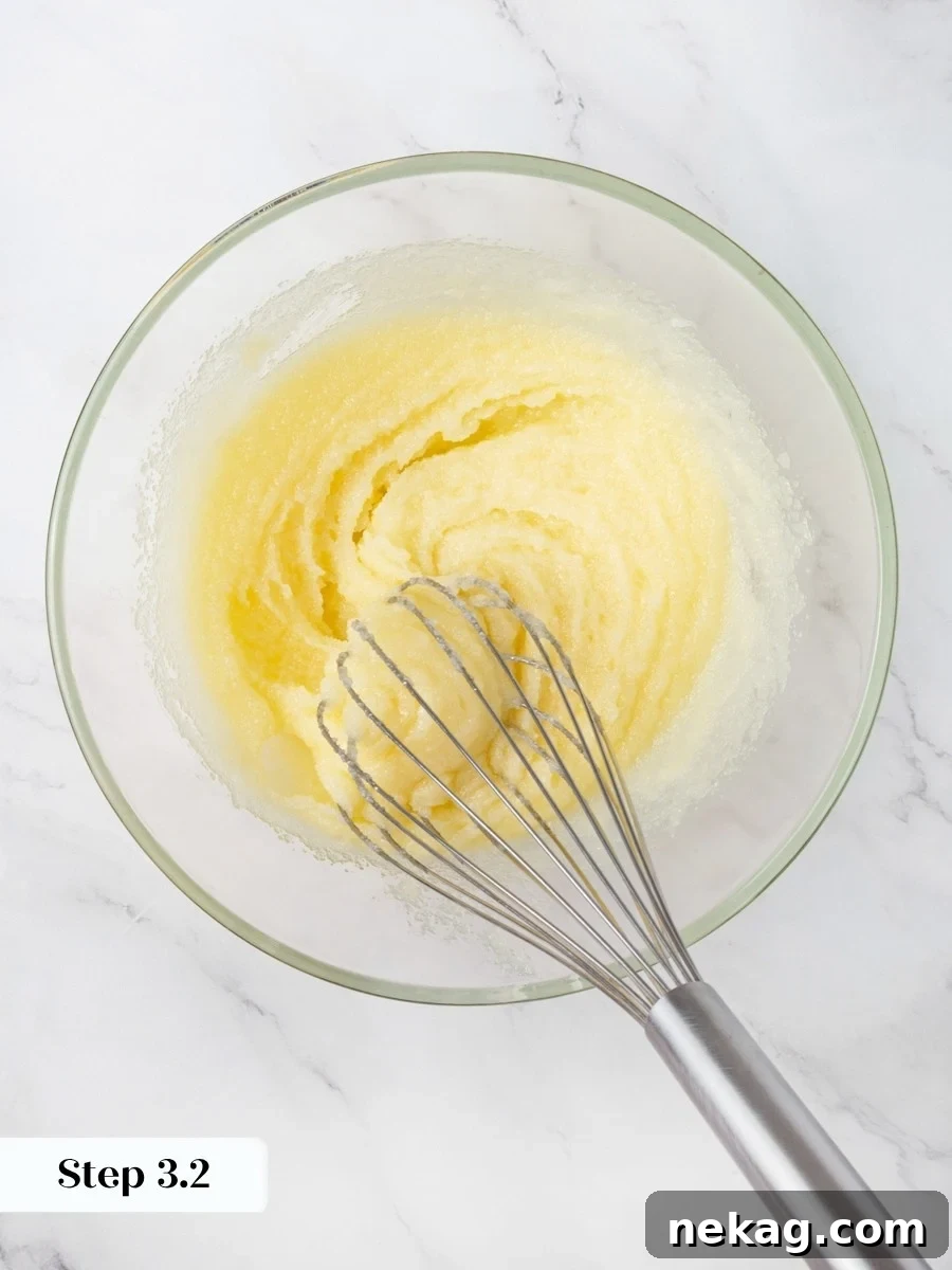 Hand-whisking dissolves the sugar, building the glossy crackly top peanut butter brownies are known for.