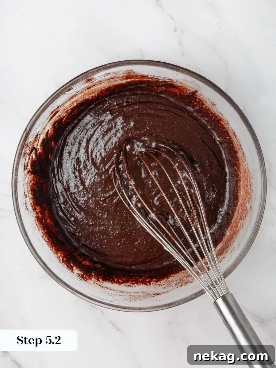 Smooth, lump-free batter signals the peanut butter brownies are ready to spread and swirl before baking.