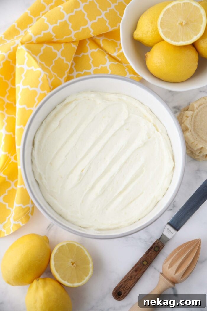 Lemon buttercream frosting in a large bowl.
