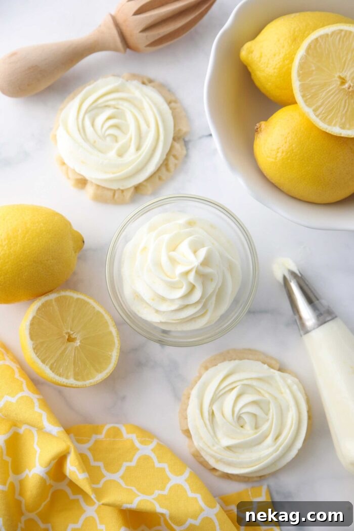 Lemon frosting piped into a small bowl and on top of sugar cookies.