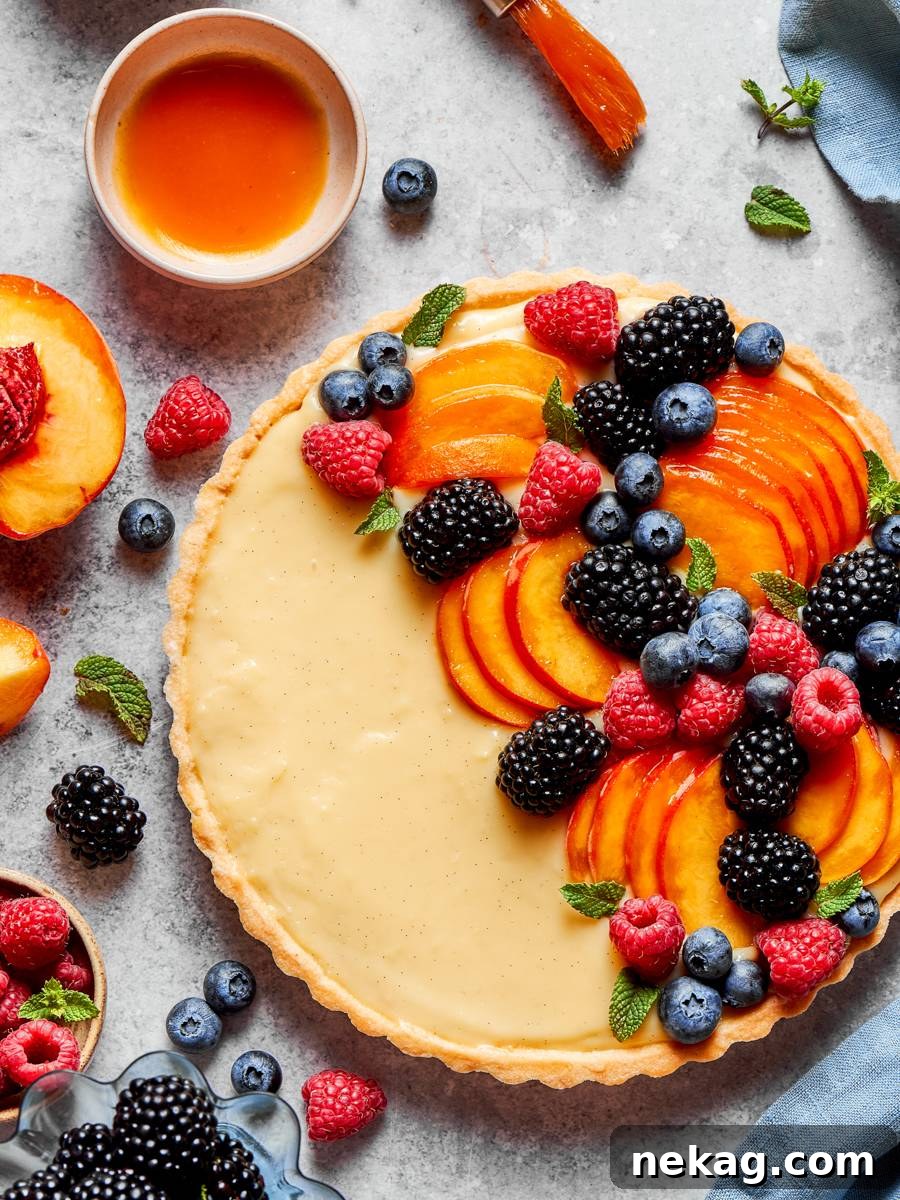 Classic Fresh Fruit Tart with Vanilla Pastry Cream 2 Glaze, fruit and the bare cream crescent all read at once in this fruit tart.
