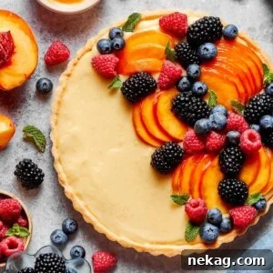 Classic Fresh Fruit Tart with Vanilla Pastry Cream 15 Squared for the recipe card, this fruit tart still holds its full fruit arc.