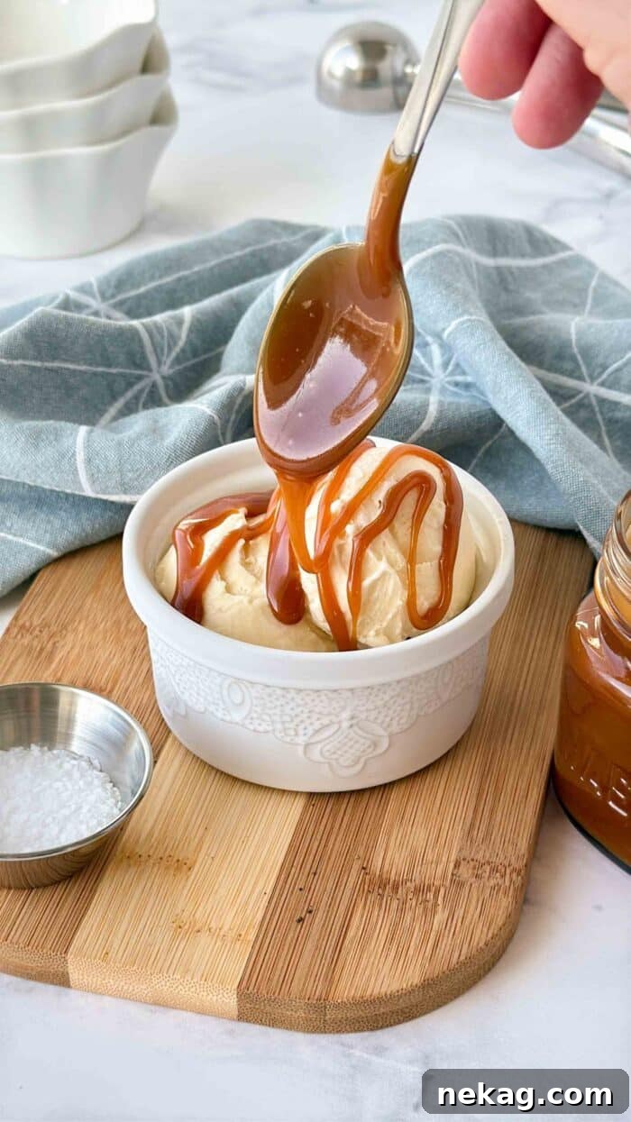 Homemade Salted Caramel Sauce Recipe 8 Drizzling salted caramel sauce over ice cream in a bowl.