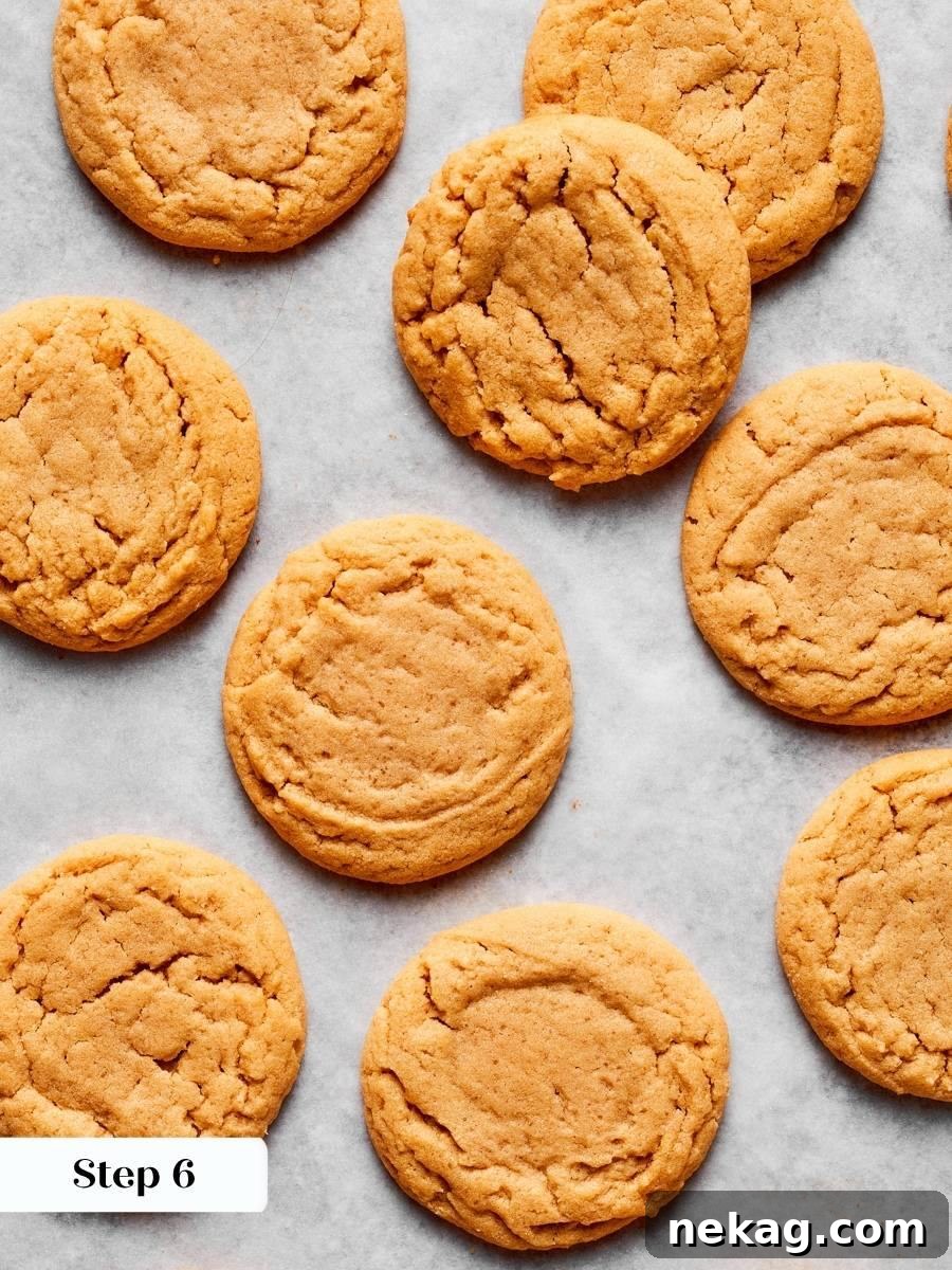 That shift from shiny to matte is the cue chewy peanut butter cookies are done.
