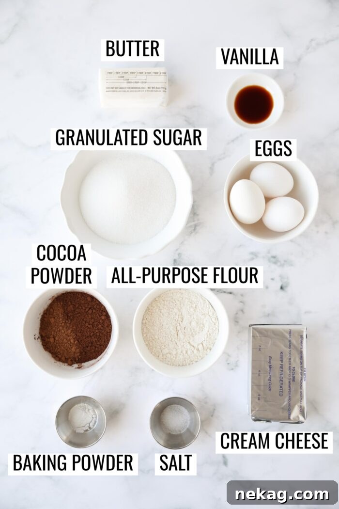 Fudgy Cheesecake Brownies Recipe 4 Labeled ingredients needed to make cheesecake brownies.